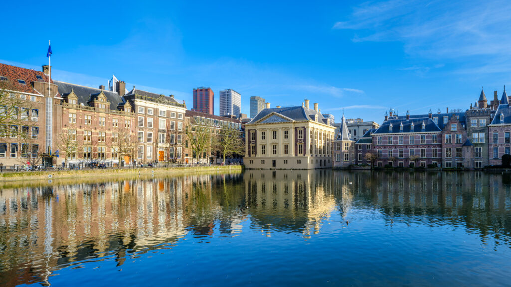 reflection of the Mauritshuis in the Hofvijver, includes torentje and Binnenhof