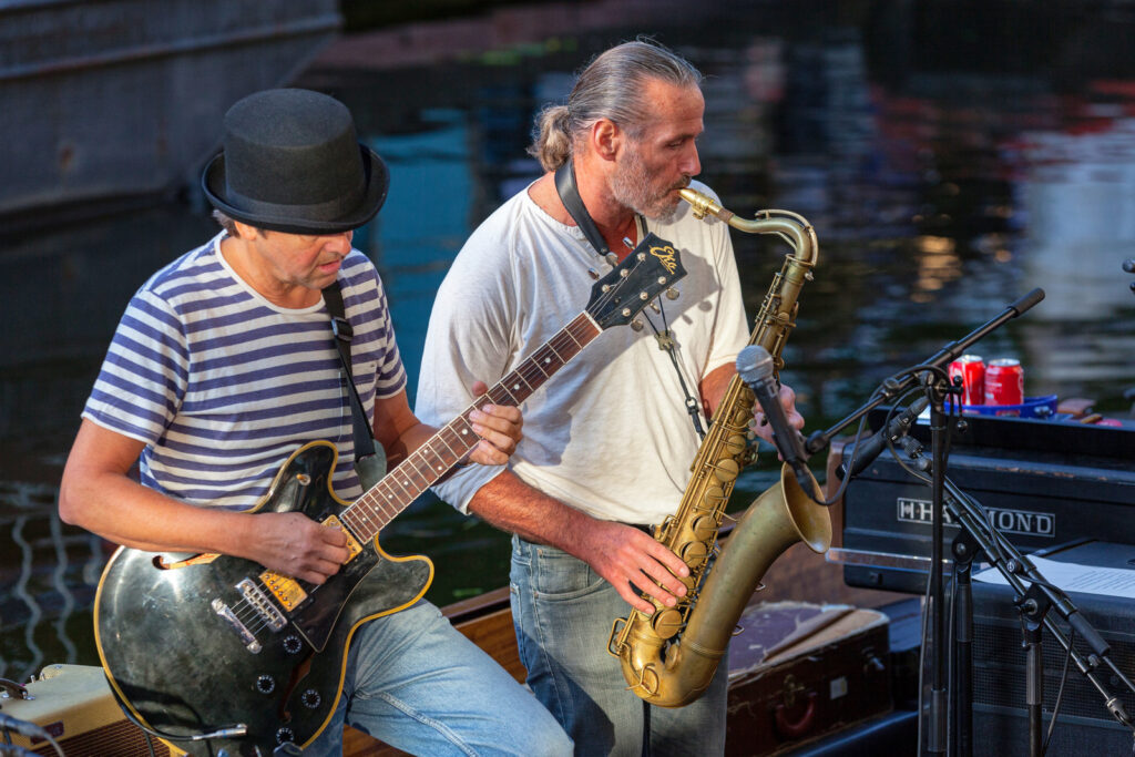 Jazz musicians playing on a canal boat